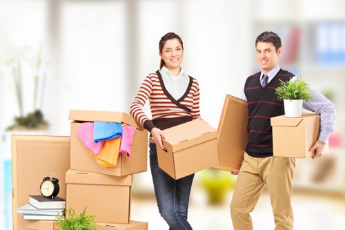Professionally insured St Johnswood removals team with PPE and safety equipment
