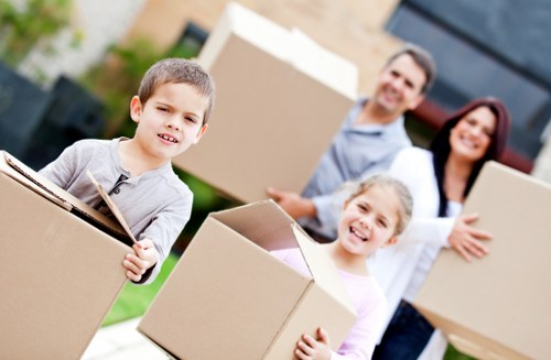 Packed moving boxes and furniture being prepared for removals in St Johns Wood